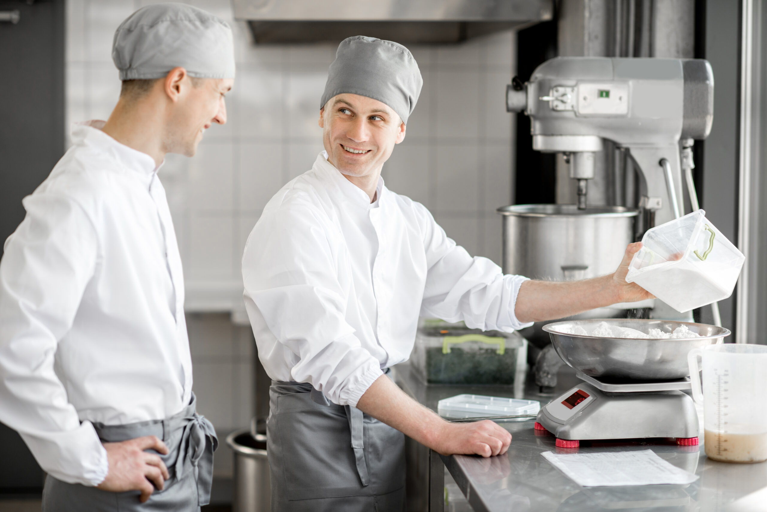 Confectioners working at the bakery manufacturing